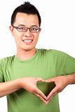 young man with two hand forming a heart shape