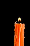 Burning orange candle