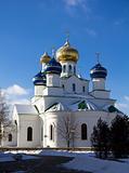 Christian orthodox church with brilliant domes against the blue sky in the winter in a sunny day Belarus Bobruisk