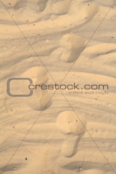 Traces of feet of  the person on sand