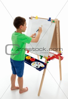 Little boy starting to paint a picture 