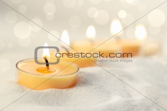 Votive candles in sand