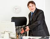 Friendly modern businessman inviting to sit on office chair
