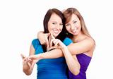 two happy young women smiling, making gestures - isolated on white