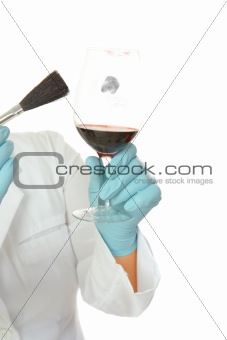 Forensic scientist dusting glass fingerprints