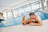 happy cople relaxing  at swimming pool