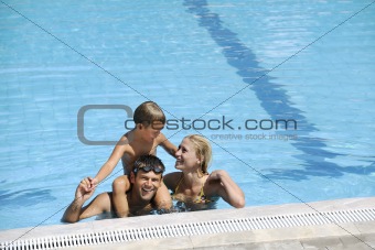 happy father and son at swimming pool