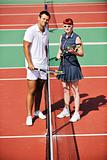 happy young couple play tennis game outdoor