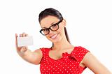 woman with glasses showing card