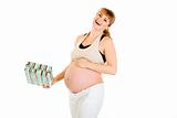 Laughing pregnant woman holding gift for her baby 
