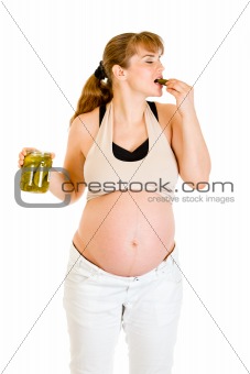  Pregnant woman eating pickles with relish. Concept - little whims!
