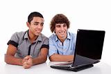 Two young man together on a laptop, isolated on white, studio shot