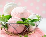 White and pink marshmallows with mint leaves