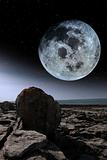 full moon and boulders in rocky burren landscape
