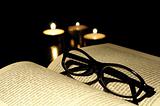 book candle and glasses