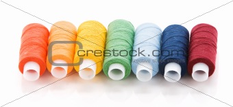 Seven spools with thread