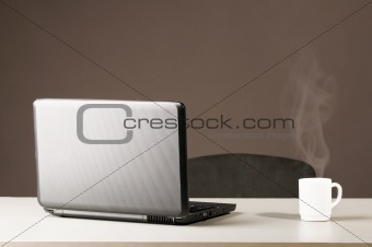 laptop with white cup