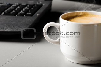 laptop with cup of coffee
