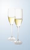 Glass with champagne over grey background