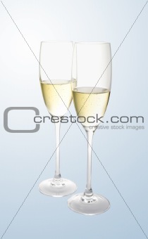 Glass with champagne over grey background