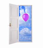 Open door in blue sky and pink air balloon