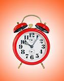 red old style alarm clock over red background