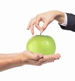 Apple between man and woman hand on white background