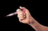 Syringe in man's hand isolated on black background
