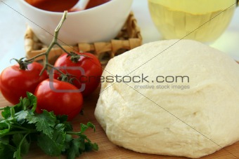 dough, tomato sauce, olive oil and tomato