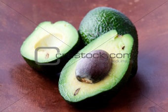 Avocados on a wooden background