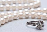 Antique Wedding Ring and Pearls with Focus on Ring.