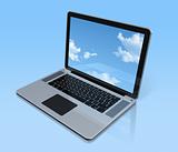 Laptop computer isolated on blue with sky screen