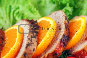 fresh juicy steak sliced, with orange peel and vegetable