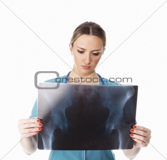 Female doctor checking xray image