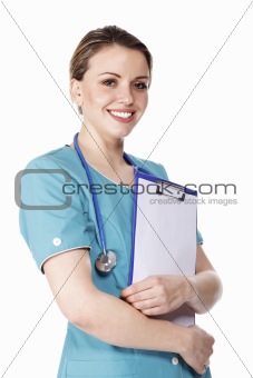 Smiling pretty female doctor holding a clipboard