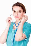 Medical doctor woman in uniform with stethoscope isolated on whi