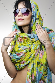 The beautiful girl in a motley scarf