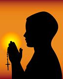 black silhouette of a praying 