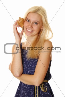 Happy young lady holding a shell