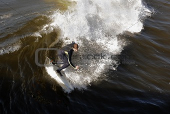 Surfer gets up on a wave. 