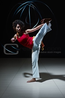 hispanic woman playing capoeira martial art