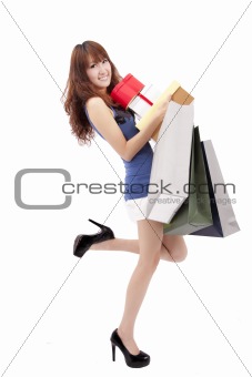 Happy asian shopping girl with a lot of gift box and shopping bag