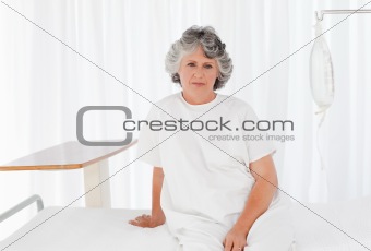 Sad woman in her bedroom