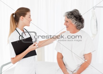 Nurse talking with her patient