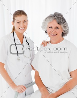Senior with her nurse looking at the camera