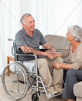 Woman with her husband in a wheelchair