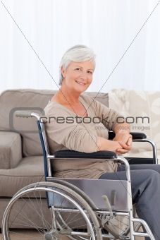 Woman looking at the camera in her wheelchair