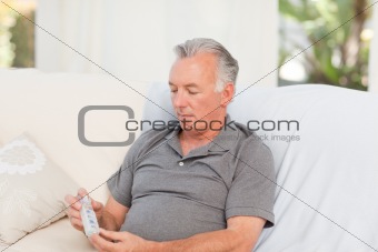 Senior with pills at home