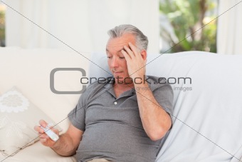Senior with pills at home