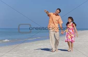 Father and Daughter Walking Holding Hands on Beach